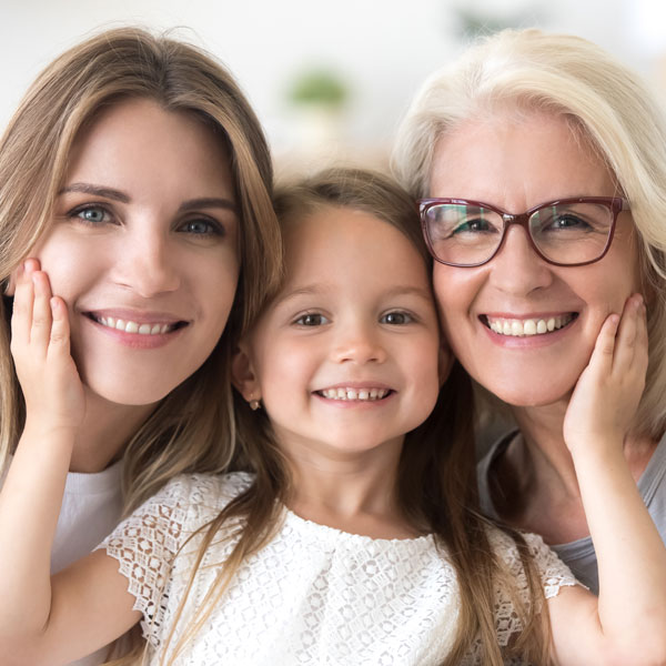 three generations of women smiling