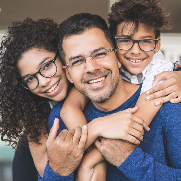 dad with two children smiling