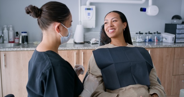 Smiling patient with dentist at Tempe Smiles receiving dental care and consultation